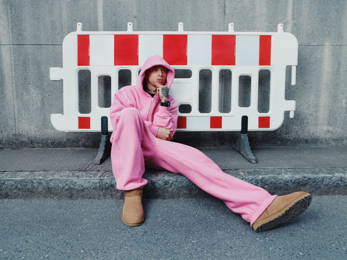 central cee in uggs in a pink tracksuit