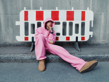 central cee in uggs in a pink tracksuit