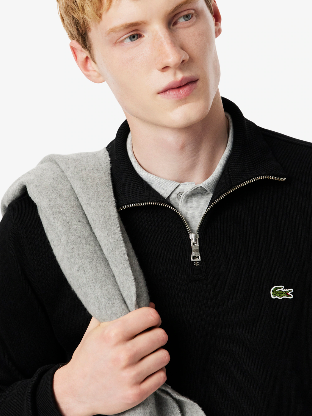 LACOSTE black interlock sweatshirt close-up detail of zip closure mechanism and crocodile logo embroidery