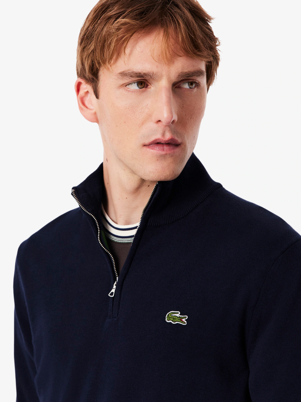 LACOSTE navy zipped sweater close-up detail of crocodile logo embroidery and cotton fabric texture