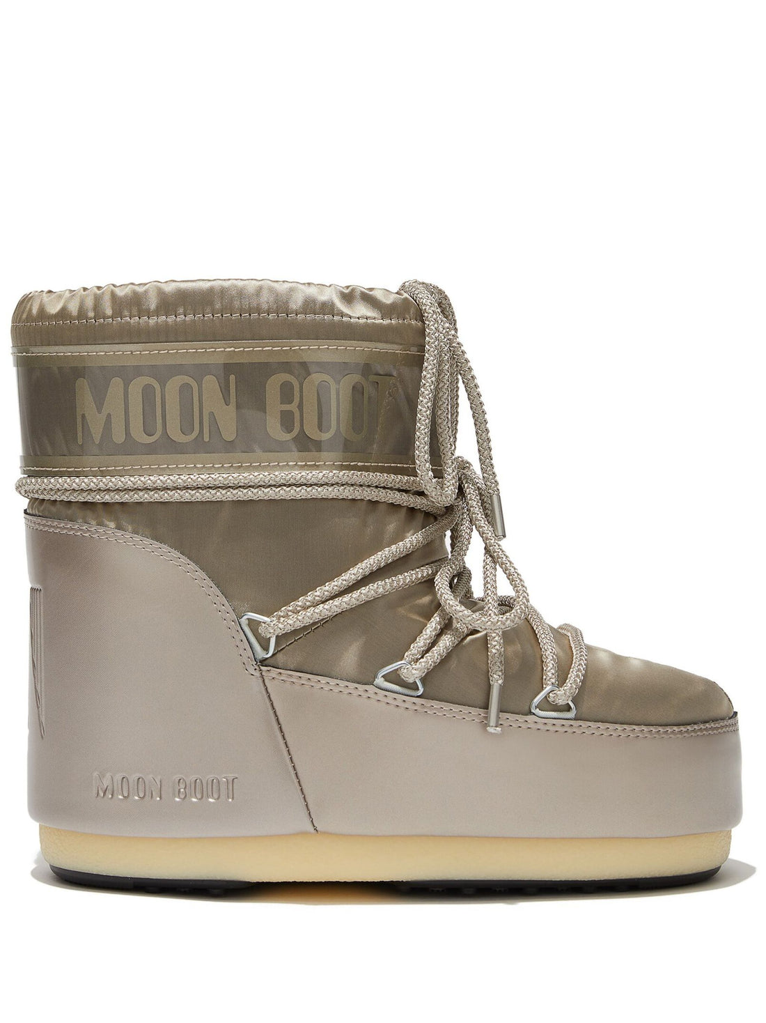 Side view of the MOON BOOT UNISEX Icon Low Glance Satin Boots in Platinum, highlighting the low-cut profile and unique reflective material.